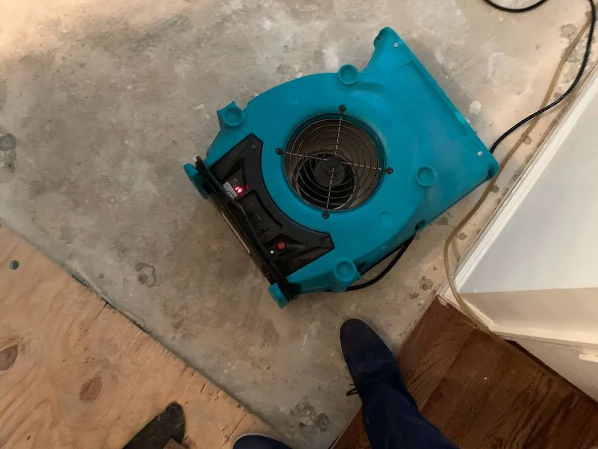 Air mover drying subfloor during Leak Detection & Repair in French Valley